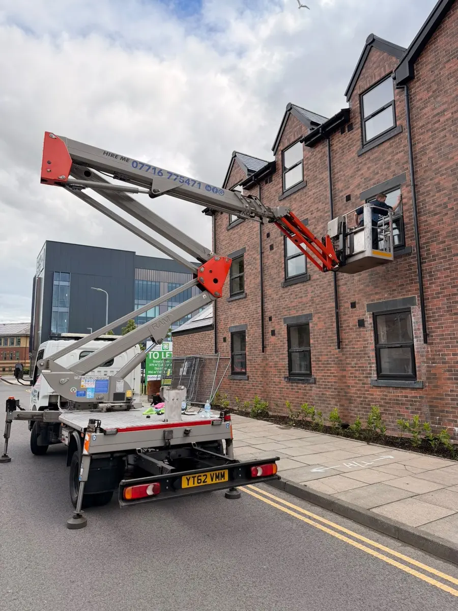 Supreme Clean cherry picker set up outside a residential development