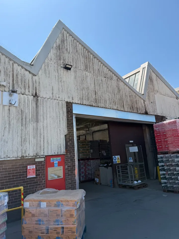 Dirty commercial cladding before exterior cleaning