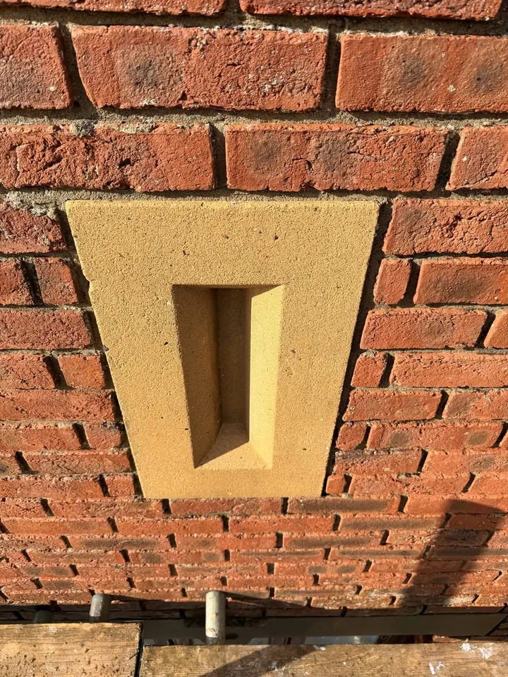 The same keystone and brickwork after DOFF steam cleaning