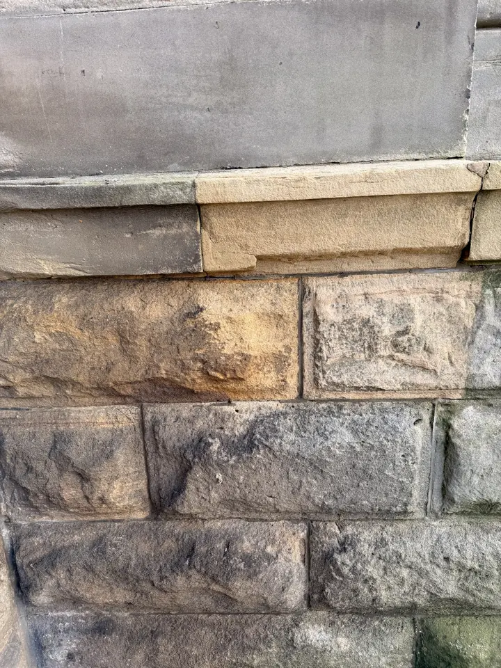 Sandstone plinth part-cleaned with DOFF