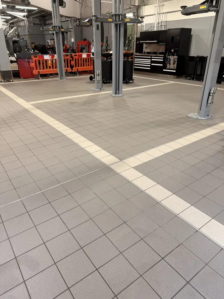 Vehicle workshop floor after steam cleaning