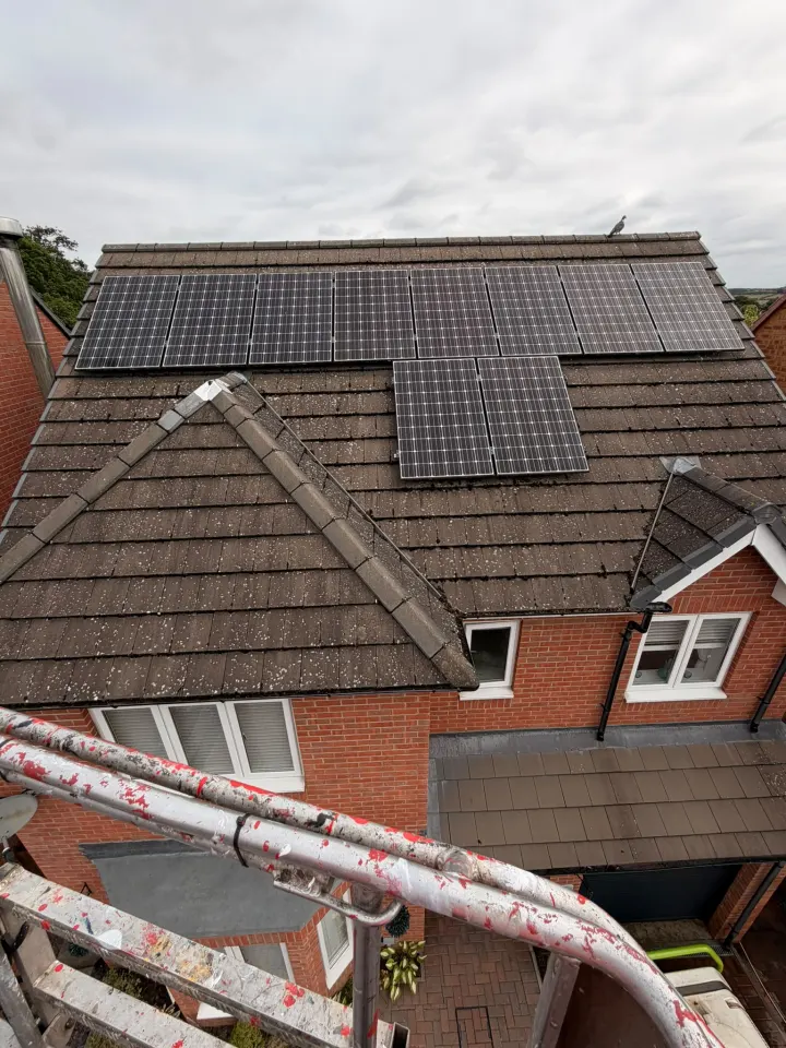 Residential roof and solar panels inspected from the access platform