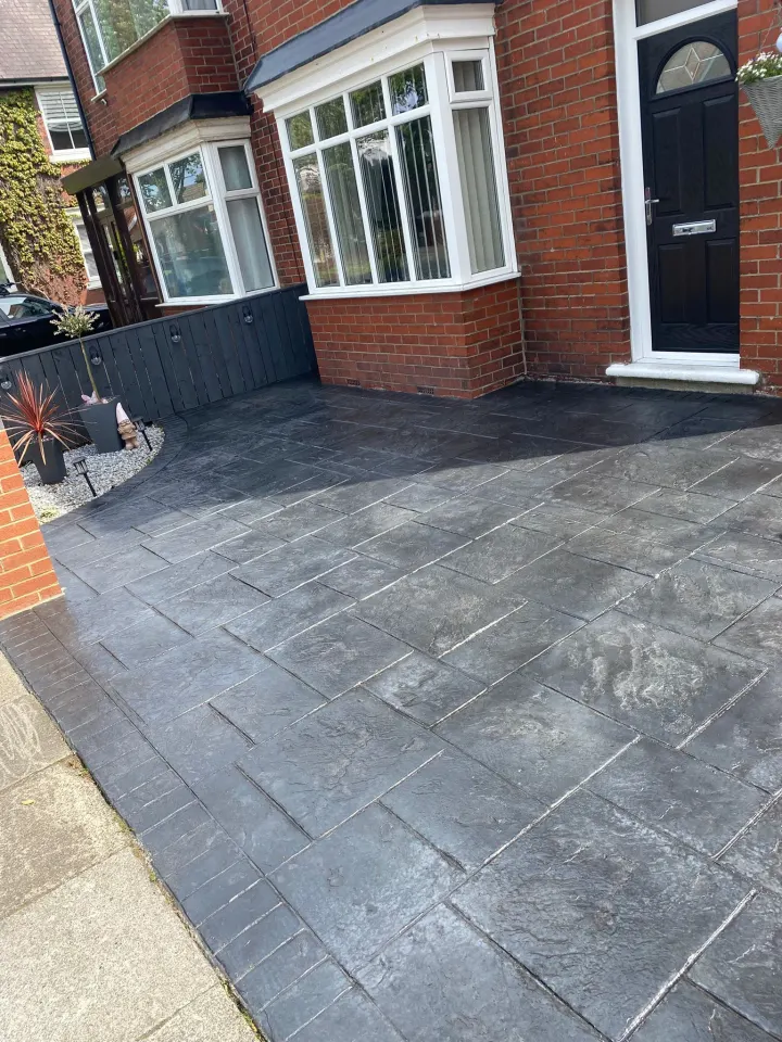 Finished black stamped driveway at a residential property