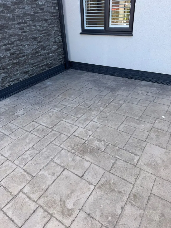 Freshly cleaned stamped concrete patio