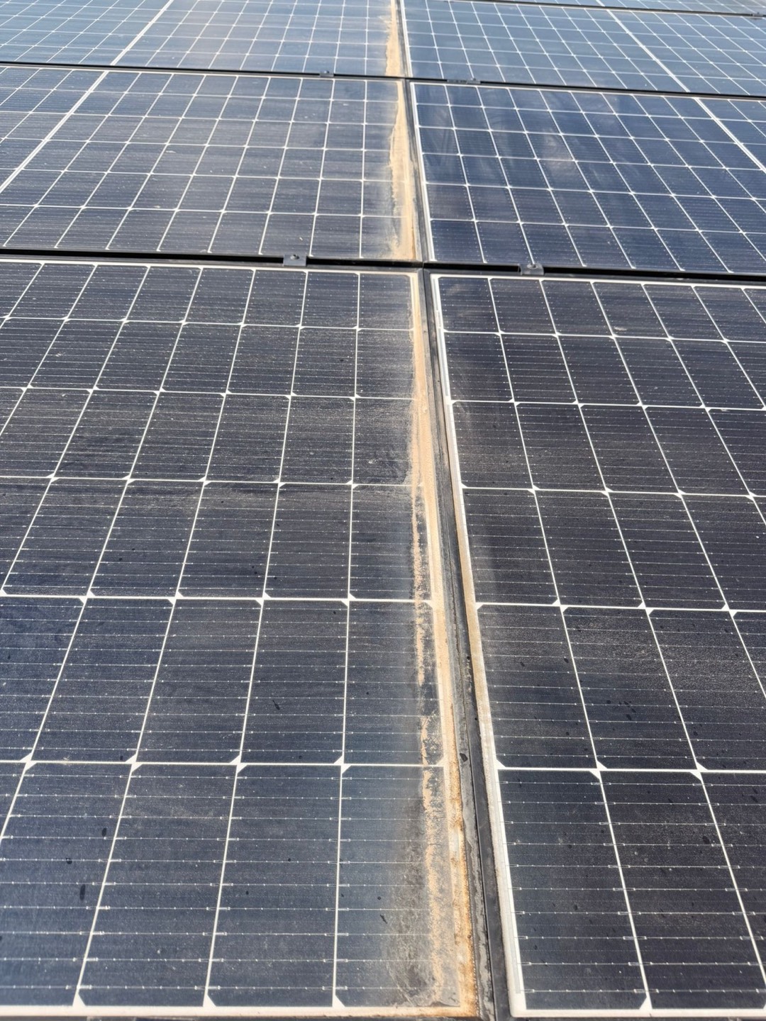 Soiled solar panels with dust and dirt build-up